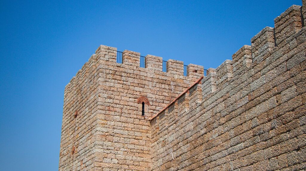 Fortified stone castle wall with battlements, a metaphor for the old network security perimeter