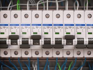 Circuit breaker panel with wires, most switches off - capability wired but not switched on